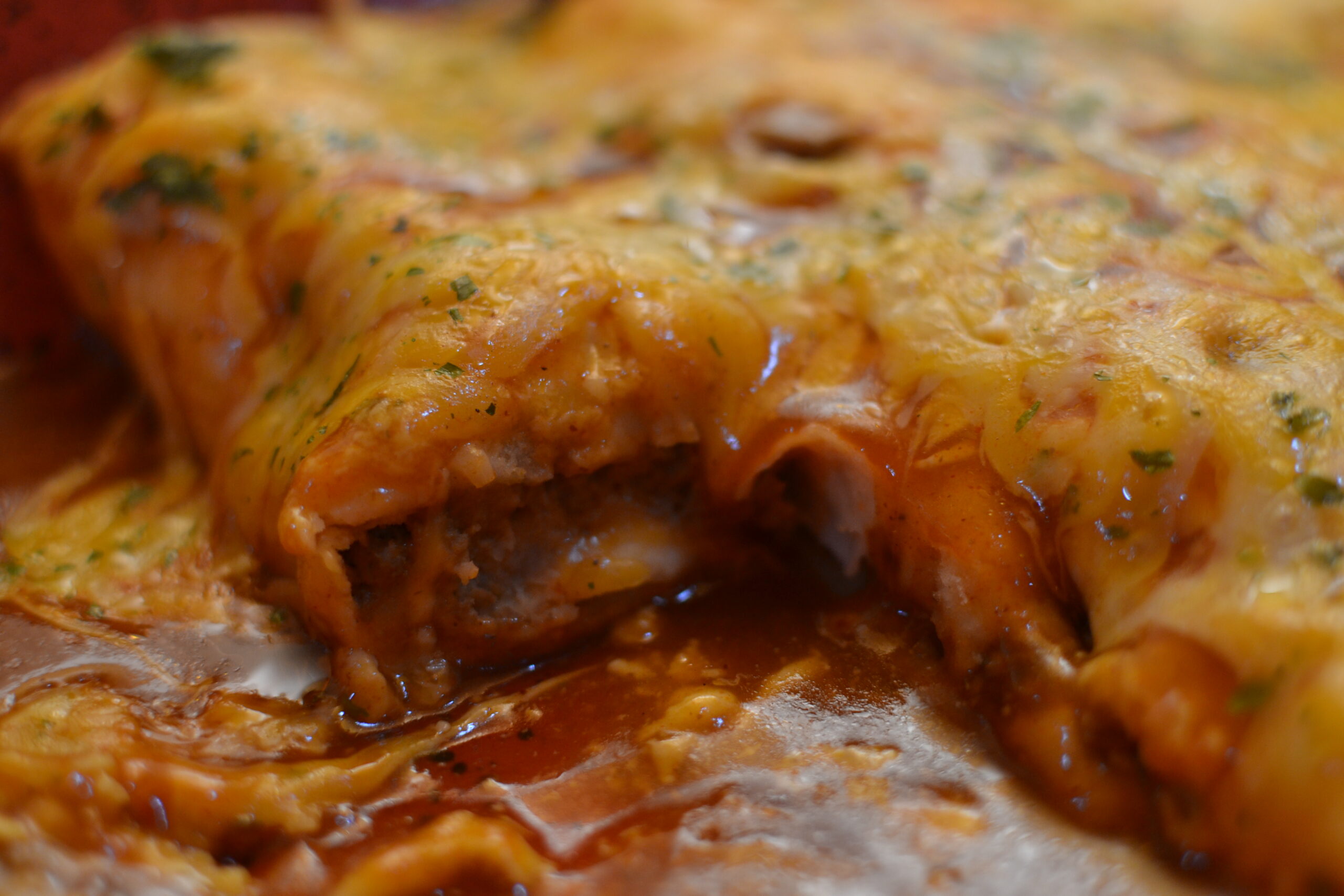 Saucy Red Enchiladas covered in melted cheese