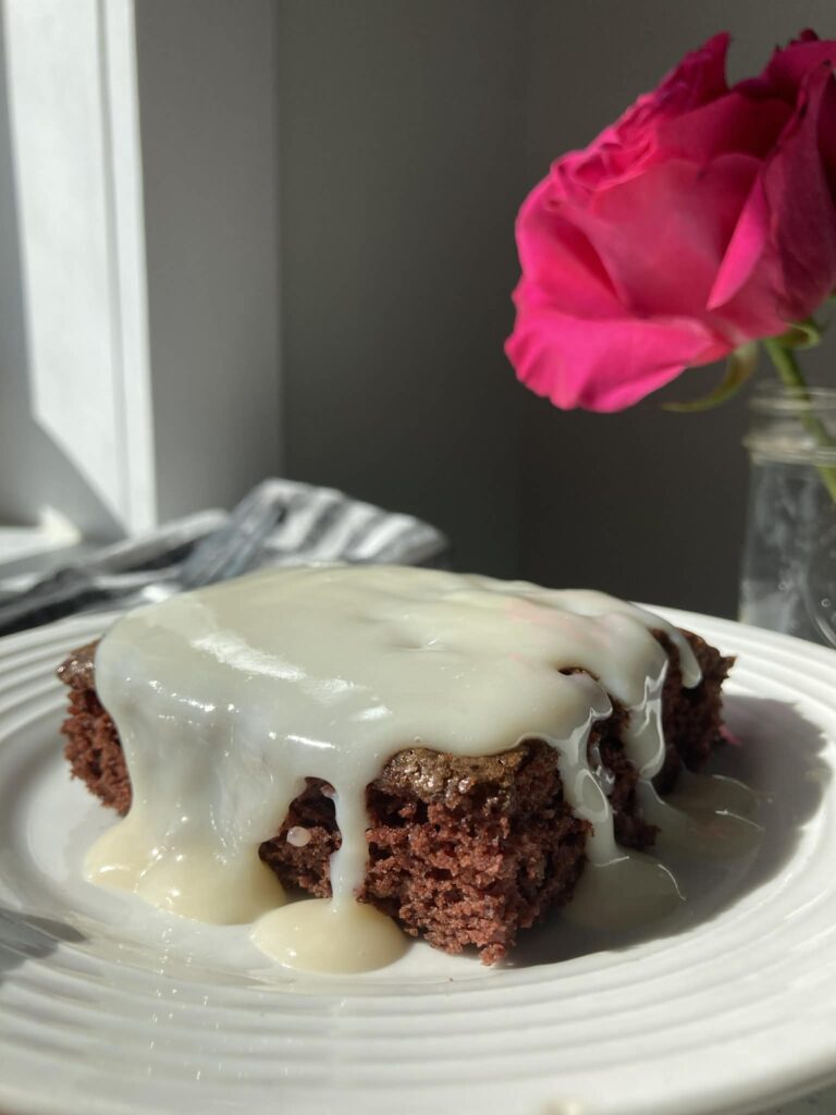 drippy icing running over chocolate cake