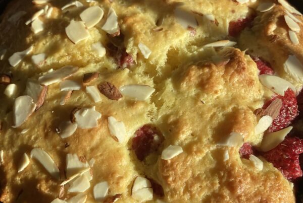 raspberry almond coffee cake in an iron skillet