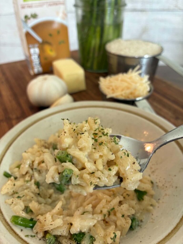 Cooked rice and asparagus in a bowl