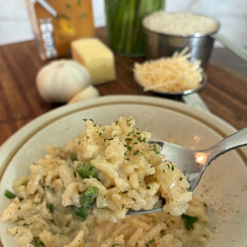 Cooked rice and asparagus in a bowl